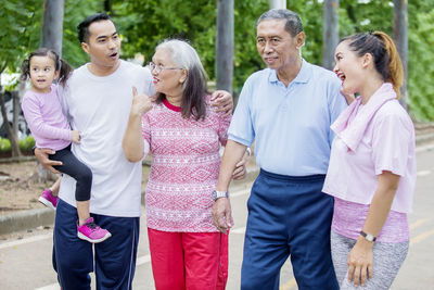 Family walking on footpath in park