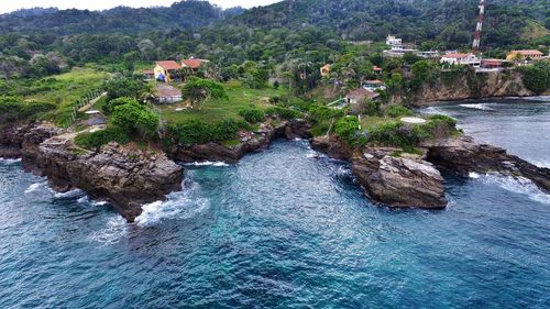 Reflection of trees in water against sky