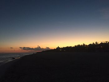 Scenic view of beach against sky during sunset