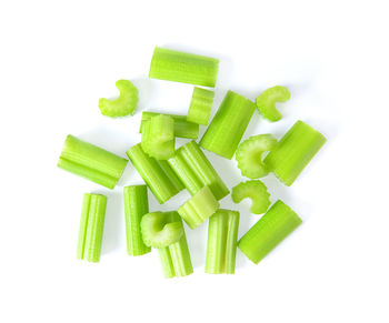 High angle view of chopped vegetables against white background