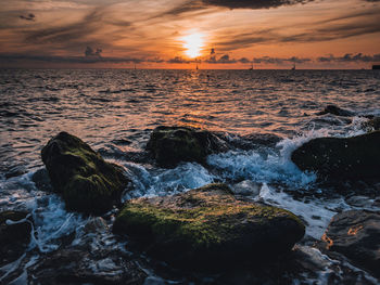 Scenic view of sea against sky during sunset