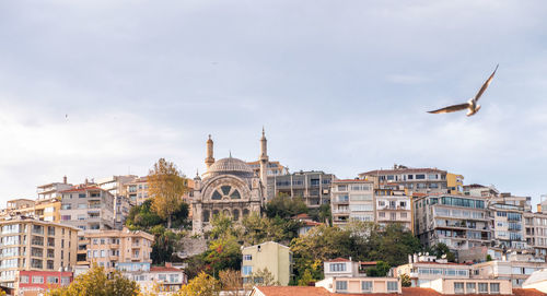 Buildings in city against sky