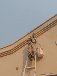 Low angle view of built structures against clear sky