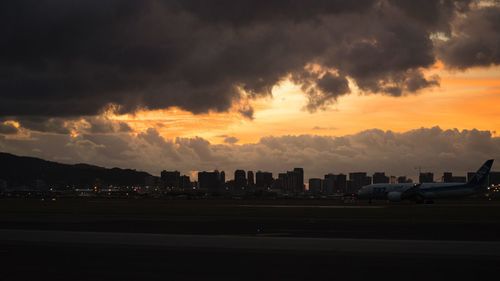 Cityscape against sky during sunset