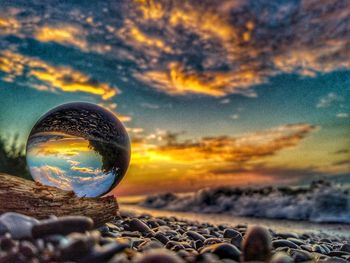 Close-up of crystal ball on rock