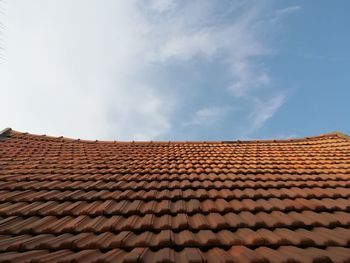 Low angle view of roof tile against sky