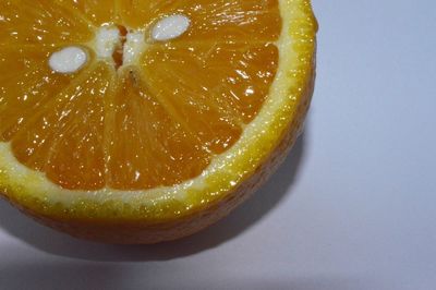 Close-up of lemon slice over white background