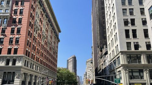 Low angle view of skyscrapers against clear sky