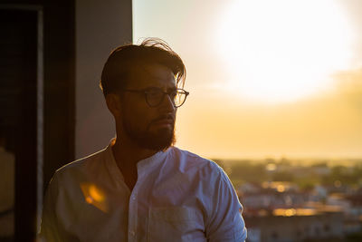 Portrait of young man looking away