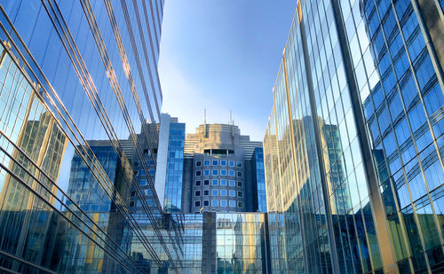 Modern buildings in city against sky