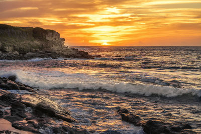 Scenic view of sea during sunset