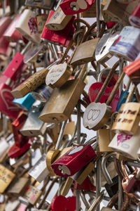 Close-up of padlocks on railing