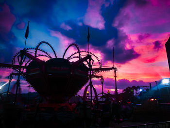 Silhouette ferris wheel against sky at sunset