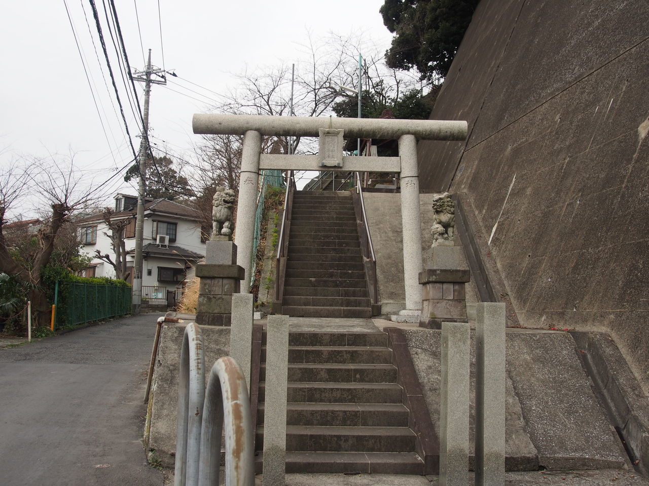 LOW ANGLE VIEW OF STAIRCASE AGAINST BUILDINGS