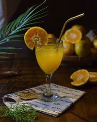 Close-up of orange juice drink on table