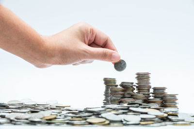 Close-up of hand holding coins