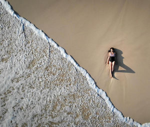 Woman standing against wall