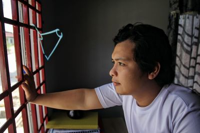 Portrait of young man looking away