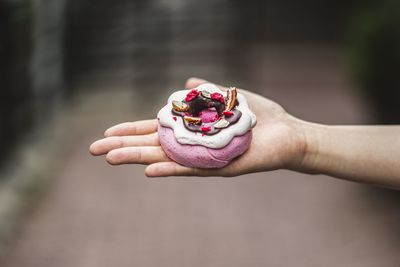 Close-up of hand holding ice cream