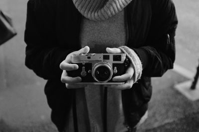 Close-up of hand holding camera