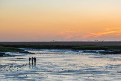 Scenic view of sea at sunset