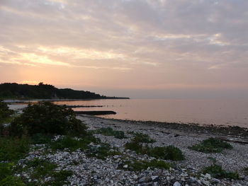 Scenic view of sea against cloudy sky