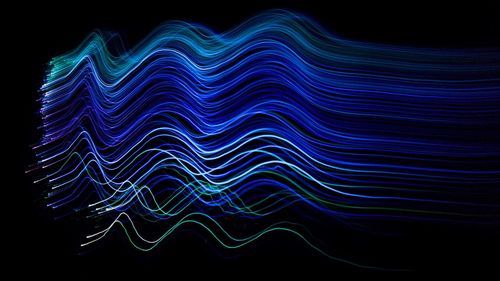 Abstract lights over black background