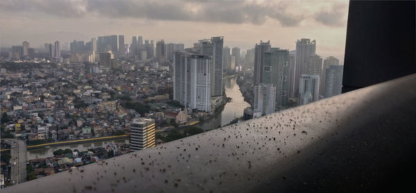 High angle view of buildings in city against sky