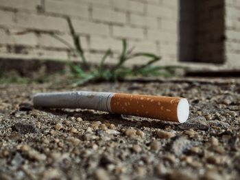 Close-up of cigarette smoking outdoors