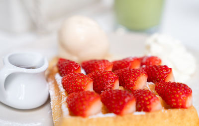 Close-up of strawberries in plate on table