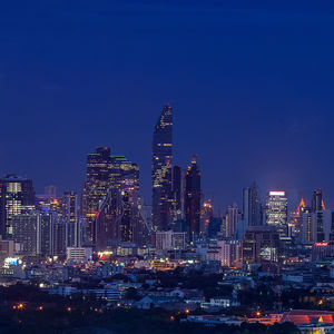 Illuminated buildings in city at night