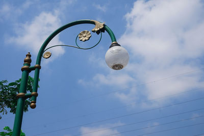 Low angle view of street light against sky