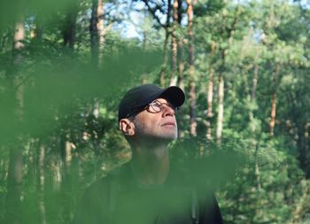 Portrait of young man in forest