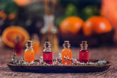 Close-up of essential oils in bottles on table