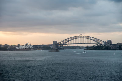 View of bridge over sea against cloudy sky