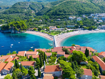 High angle view of townscape by sea