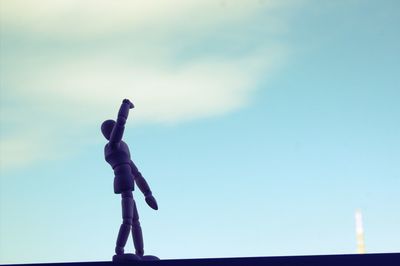Low angle view of statue against blue sky
