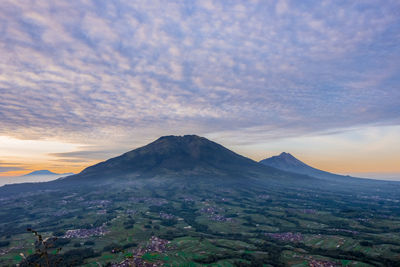 Scenic view of mountains against sky during sunset