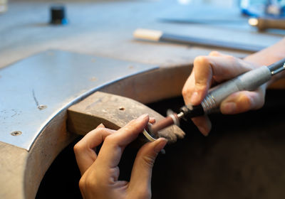 Close-up of jeweler making ring