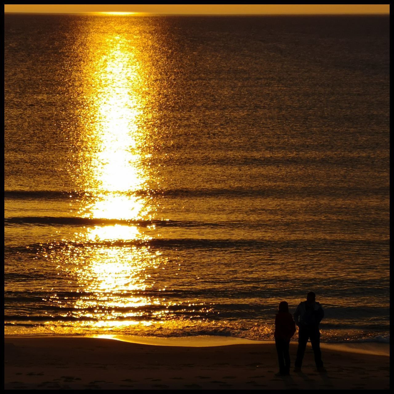 SILHOUETTE PEOPLE AT BEACH DURING SUNSET