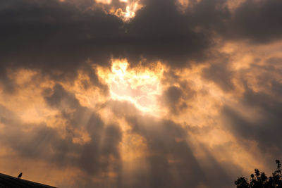 Low angle view of clouds in sky during sunset