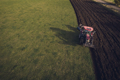 Tractor plowing field at autumn