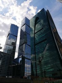 Low angle view of modern buildings against sky