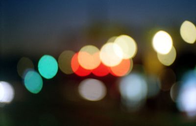 Defocused image of illuminated city street