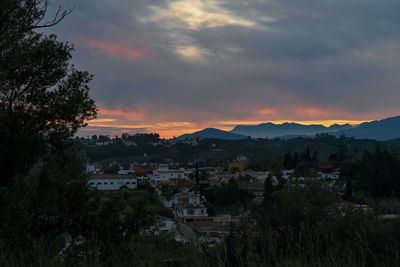 View of townscape against sky during sunset