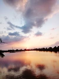 Scenic view of lake against sky during sunset
