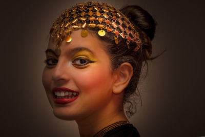 Close-up portrait of beautiful woman wearing headwear