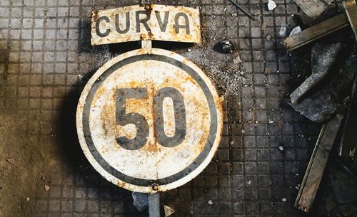 Close-up of sign on road