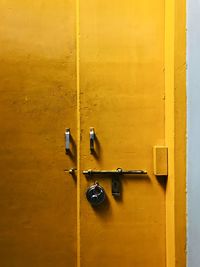 Close-up of yellow door