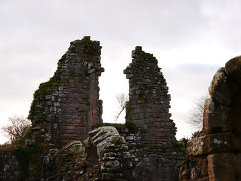 Low angle view of old ruin against sky